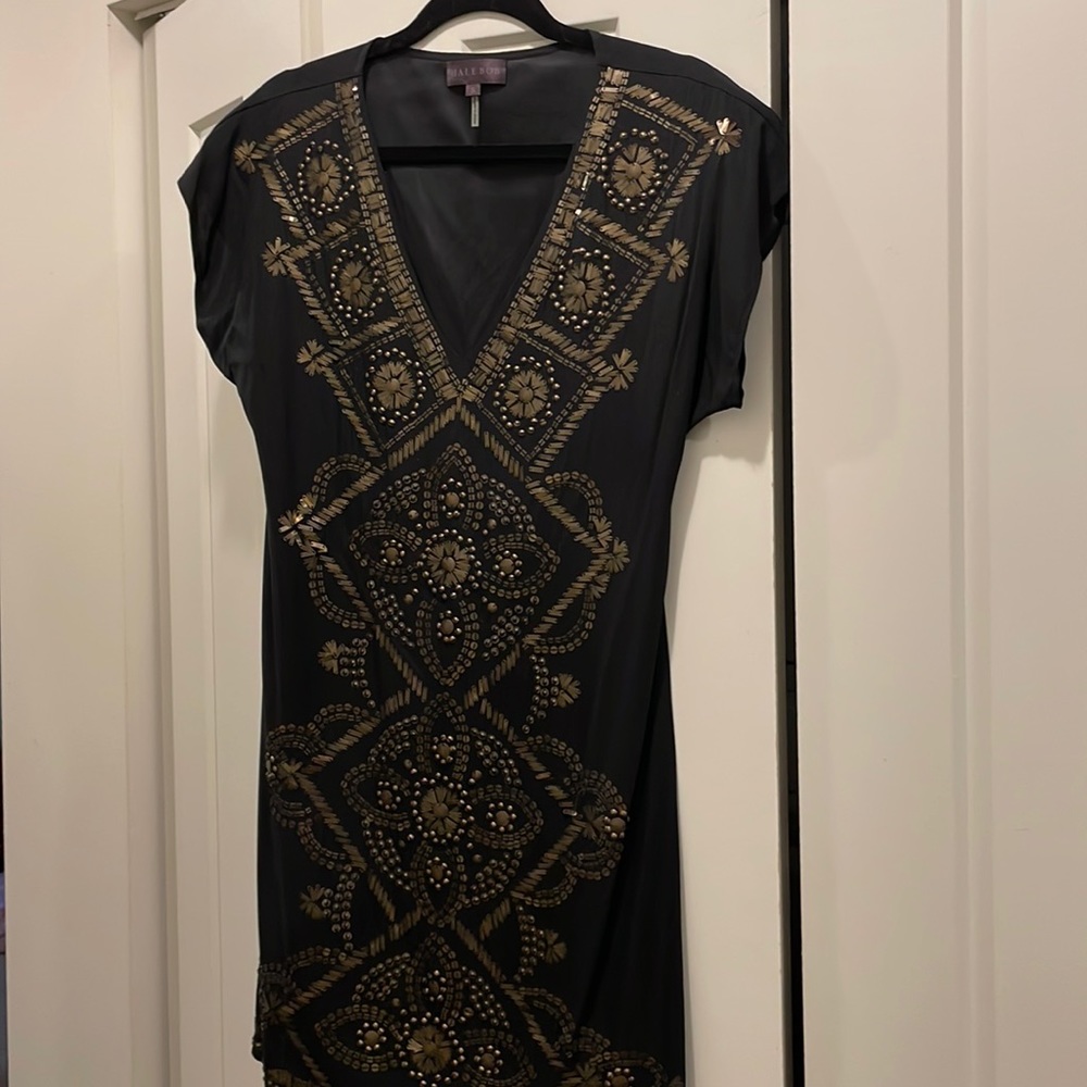 Black silk dress with brassy details